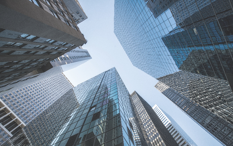 Looking straight up at tall buildings